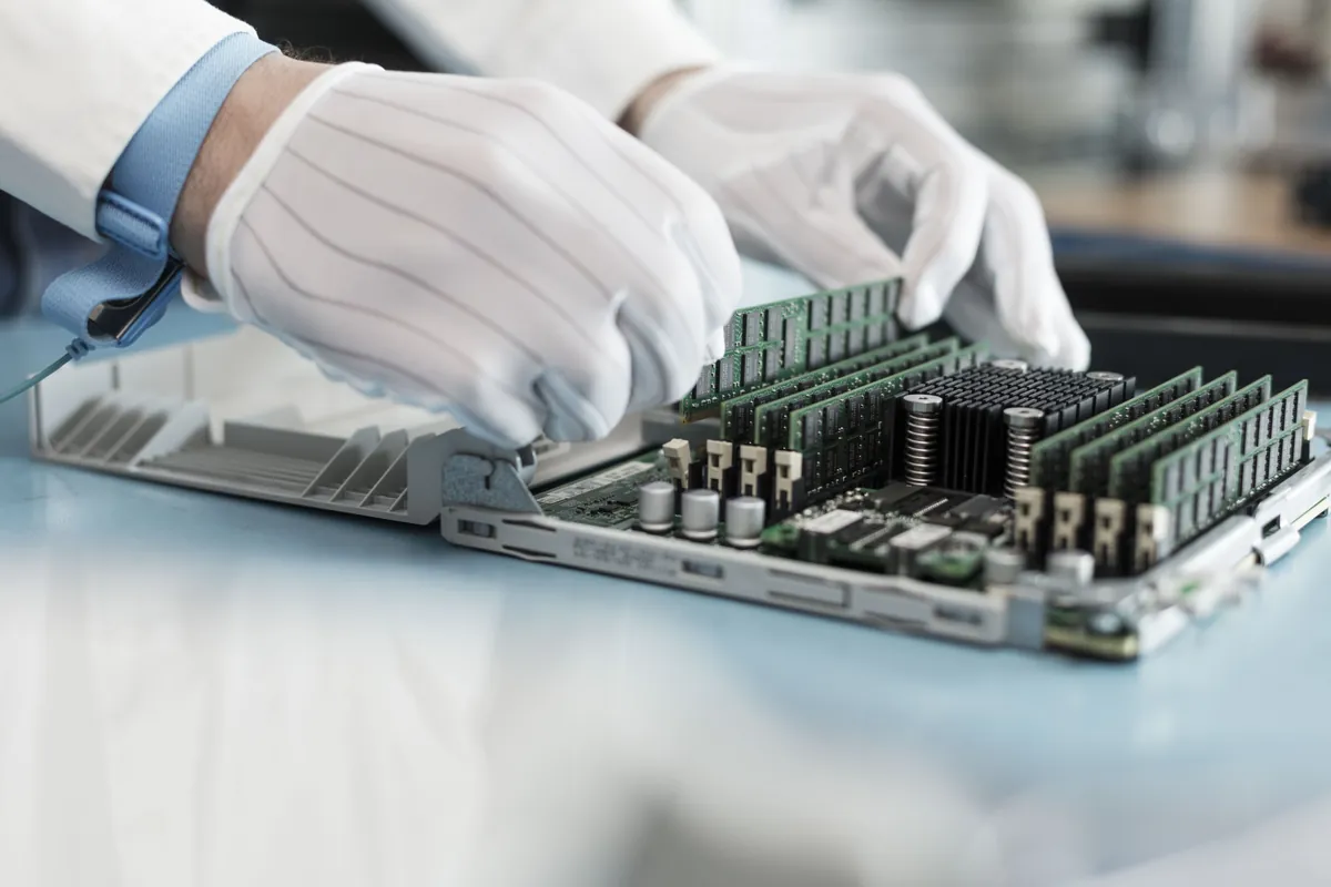 Technician performing maintenance on server hardware